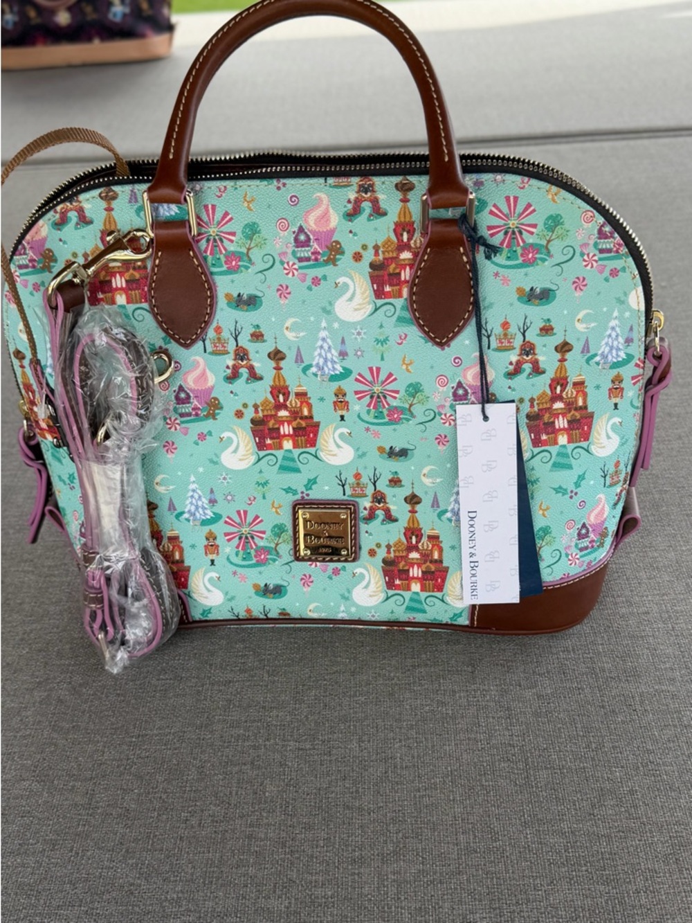 Dooney & Bourke Teal Printed Dome Satchel with Brown Trim and Pink Accents